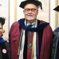 Lewis, Dean Antczak, and Kurjiaka pose in their regalia